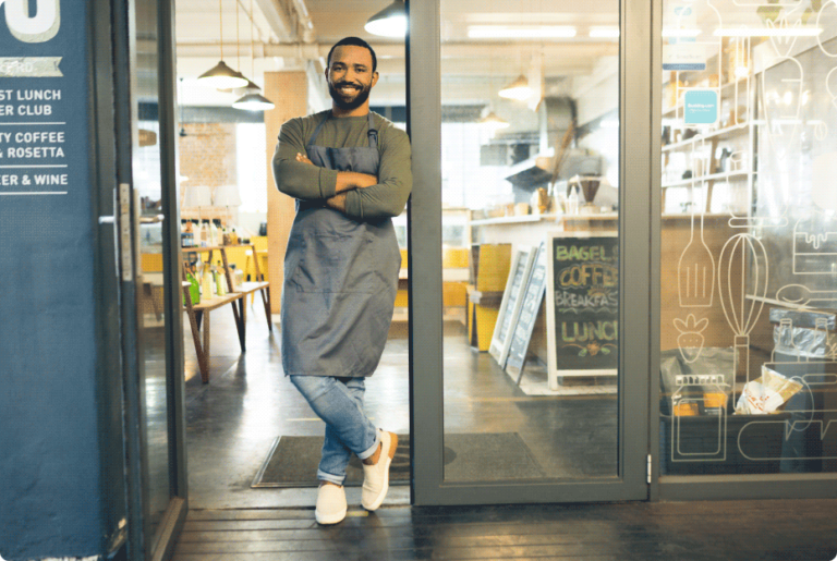 Happy man, portrait and small business owner on door of cafe