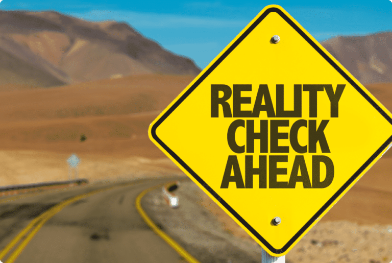 Reality Check Ahead sign on desert road